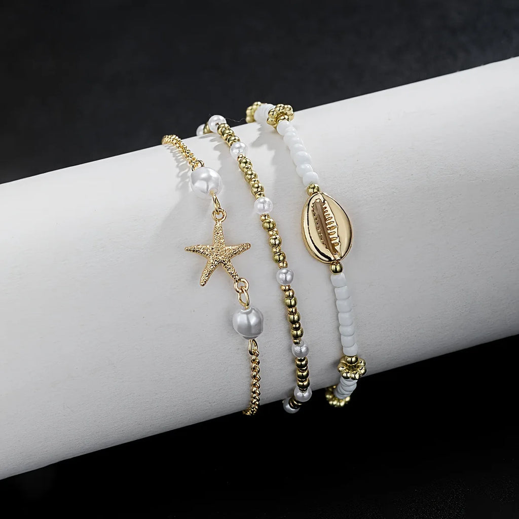 Women's Bohemian Style Beach Vacation Ankle Chains Three-Layer Foot Accessories with Rice Pearls Seashells And Starfish